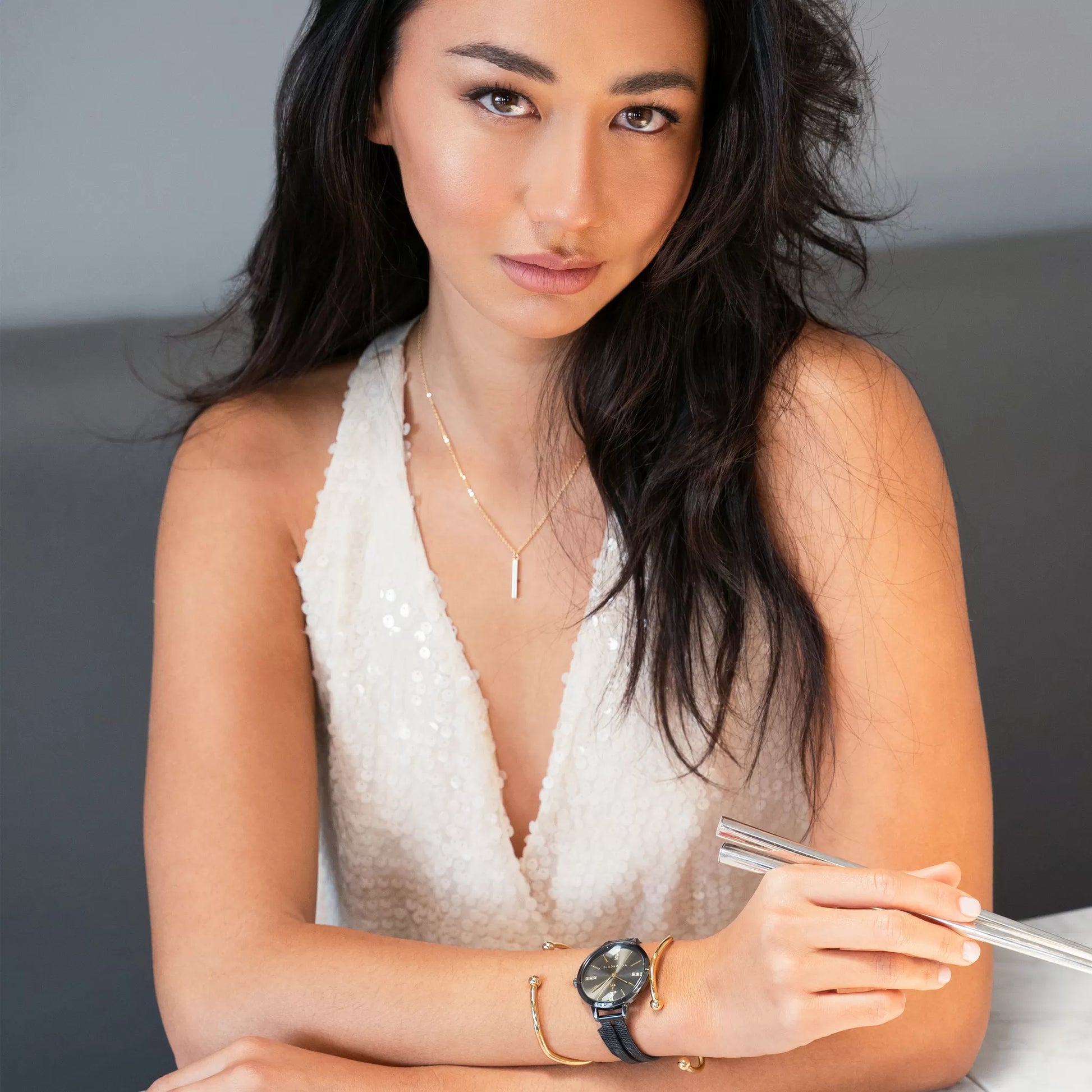 Model wearing Monarchic® Watch - Cialani - Black and Gold women's watch with double band and gold accessories