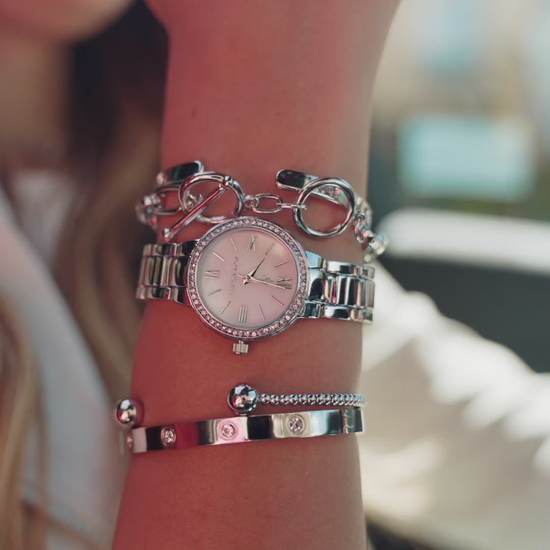 Video short of model wearing Monarchic® Watch - Cosmopolitan - Coco Edition - Silver link watch and silver accessories